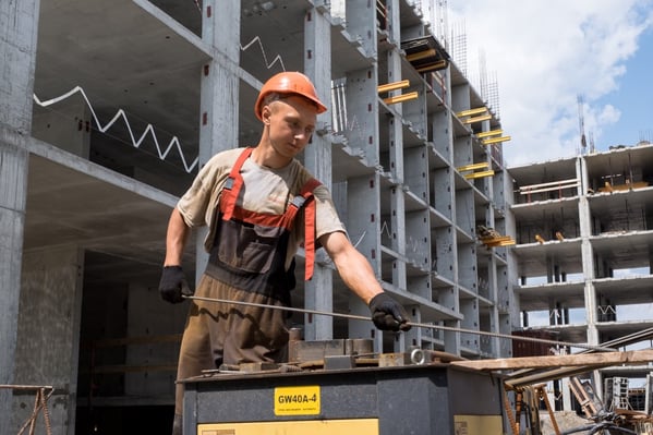 worker-in-orange-helmet-fixing-steel-reinforcement-for-house_t20_VK7JG6-1